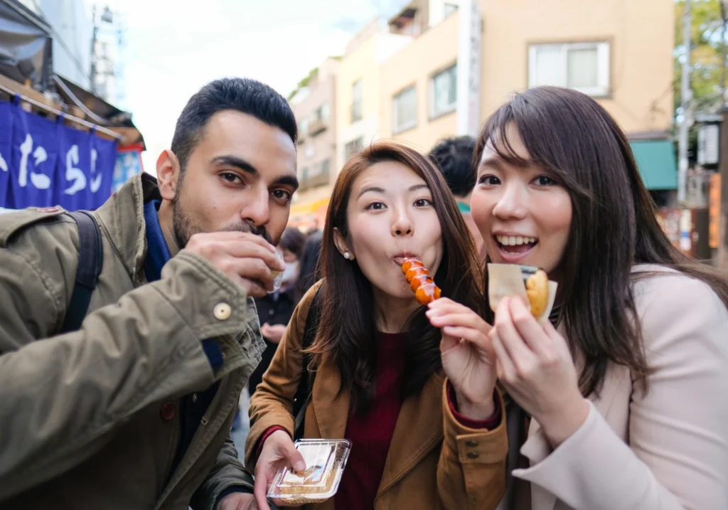3 friends are enjoying japanese food