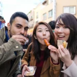 3 friends are enjoying japanese food